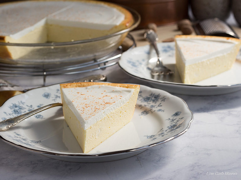 Slice of cheese pie or crustless cheesecake on a blue and white china plate.