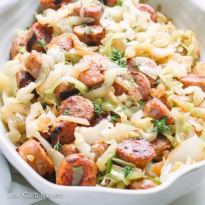 Cooked sliced sausage and cabbage in serving bowl.