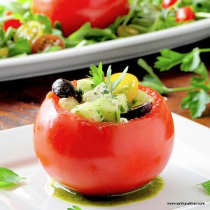 Stuffed Greek Tomatoes make a great stand alone salad or a side for Summer grilled meats. | low carb & gluten-free | lowcarbmaven.com