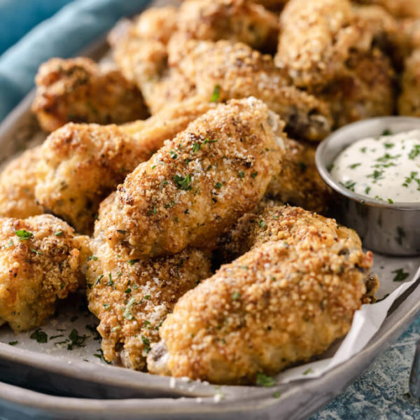 Crispy garlic Parmesan chicken wings with dipping sauce. 