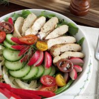 Grilled chicken salad with vegetables in a bowl