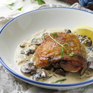 Chicken Thighs with Mushrooms and Tarragon Cream features golden chicken thighs in a white wine and cream sauce flavored with shallots and fresh tarragon. 7 net carbs per serving.