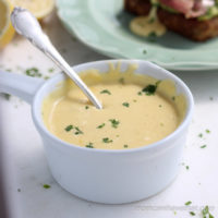 This recipe for blender Hollandaise will have your poached eggs or veggies sauced in minutes with minimum effort. It's silky, creamy, buttery and easy. | lowcarbmaven.com