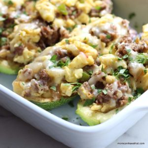 Zucchini Breakfast Boats filled with sausage, scrambled eggs and pepper jack cheese. | low carb, gluten-free, keto, thm | lowcarbmaven.com