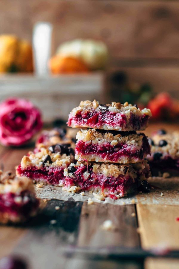 Sliced cranberry crumb bars with walnuts and chocolate chips stacked
