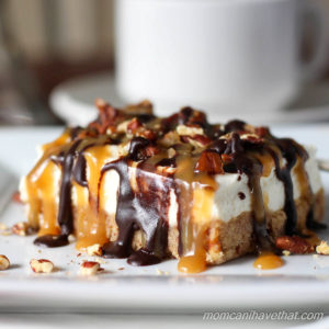 Pecan Turtle Cheesecake Bars have a brown sugar pecan crust & light-textured vanilla cheesecake topped with toasted pecans, chocolate fudge, & caramel. No-bake, low carb & sugar free | lowcarbmaven.com