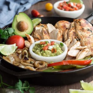 This authentic chicken fajitas recipe results in juicy and flavorful chicken and charred vegetables with minimal effort. Make it easy on yourself and buy the pico de gallo and guacamole from your favorite local taco shop to bring the whole meal together. | Low Carb, Gluten-free, Paleo, Whole 30