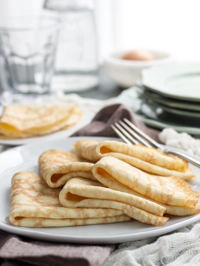 Low Carb Crepes made with coconut flour result in thing flexible pancakes almost like the real thing. #crepes #lowcarb #keto #coconutflour #sugarfree #glutenfree