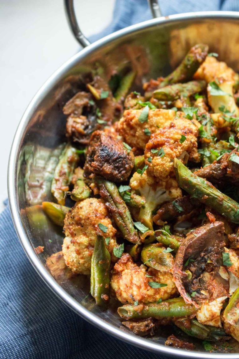 Indian Roasted Vegetables: An easy side of cauliflower, green beans and mushrooms flavored with tomato and Indian spices. | low carb, gluten-free, dairy-free, paleo, whole 30