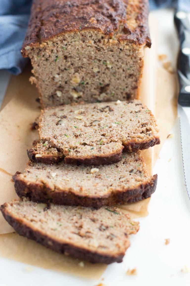 Sliced Low Carb Zucchini bread on a cutting board.