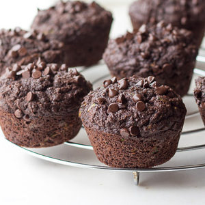Low carb chocolate zucchini muffins made with coconut flour are gluten-free and perfect for a ketogenic diet. THM