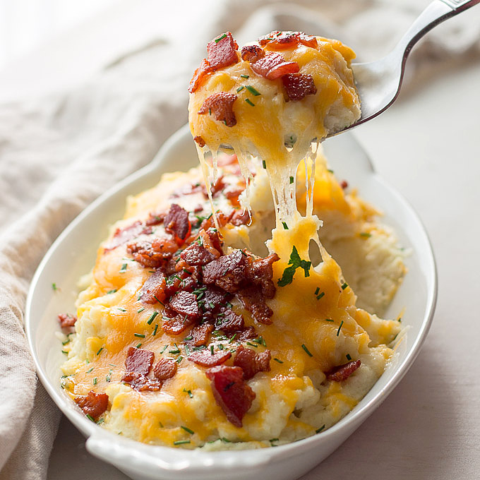 Low carb loaded cauliflower with sour cream, chives, cheddar cheese and bacon. Keto.