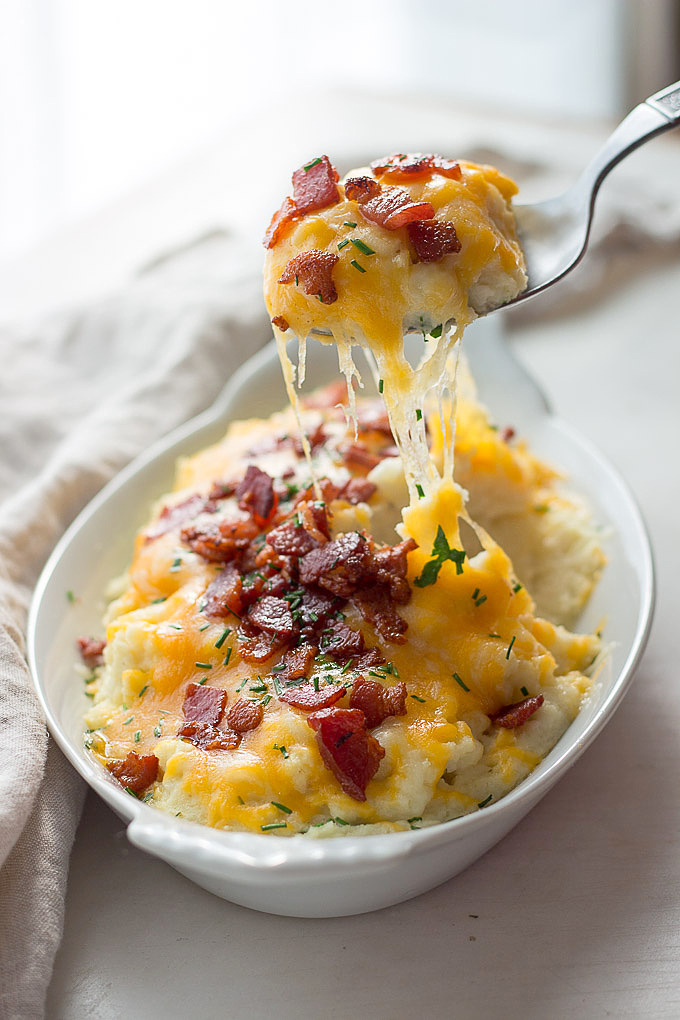 Low carb loaded cauliflower with sour cream, chives, cheddar cheese and bacon. Keto.