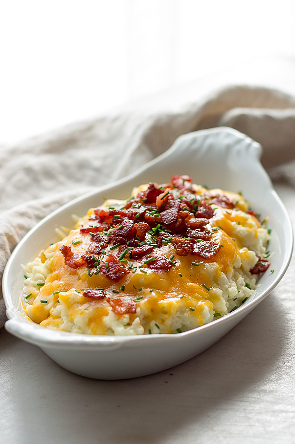 Low carb loaded cauliflower with sour cream, chives, cheddar cheese and bacon. Keto.