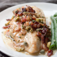 Pan seared chicken with a piquant sauce of bacon, caper, lemon, olives, and butter, shows low carb eating at it's best.
