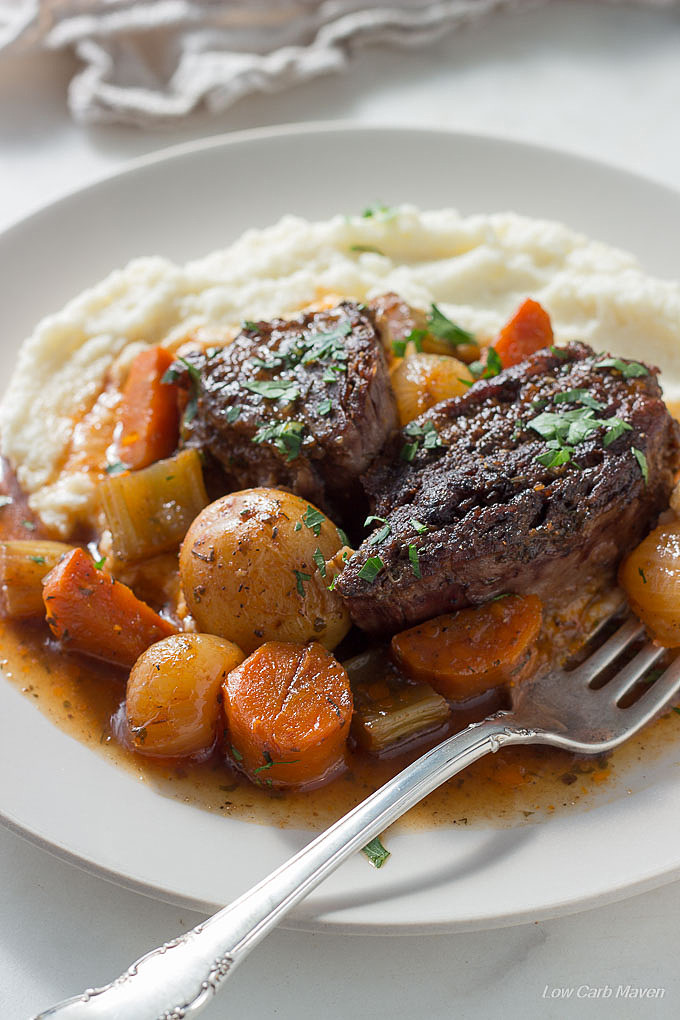 Low carb pot roast with vegetables in gravy served on cauliflower mash. keto, LCHF