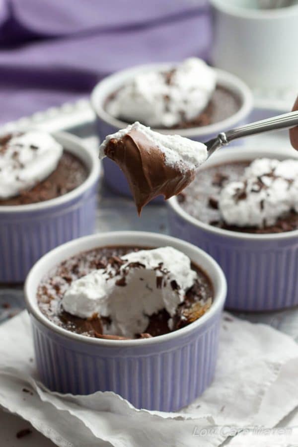 Low Carb Chocolate Truffle Creme Brulee with whipped cream on a spoon