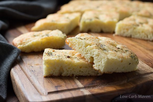 Gluten free low carb focaccia made with almond flour stacked on a cutting board.