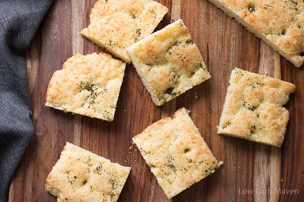 Gluten free low carb focaccia squares on a cutting board.