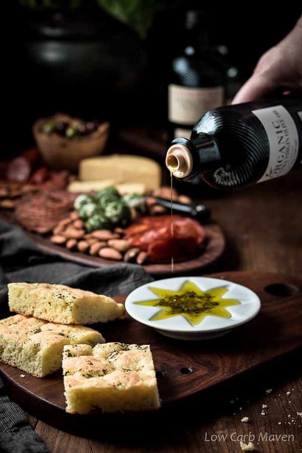 Gluten free low carb focaccia with olive oil dipping sauce and Carapelli Olive Oil.