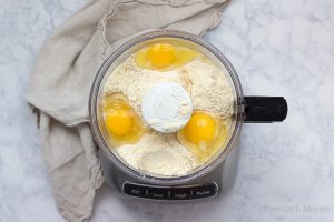Almond flour and eggs in a food processor.