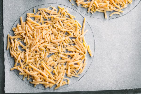 shredded cheddar cheese for low carb taco shells on parchment