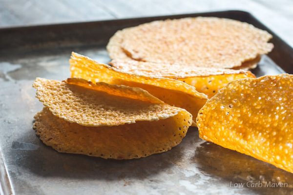 cheddar cheese taco shells on a tray