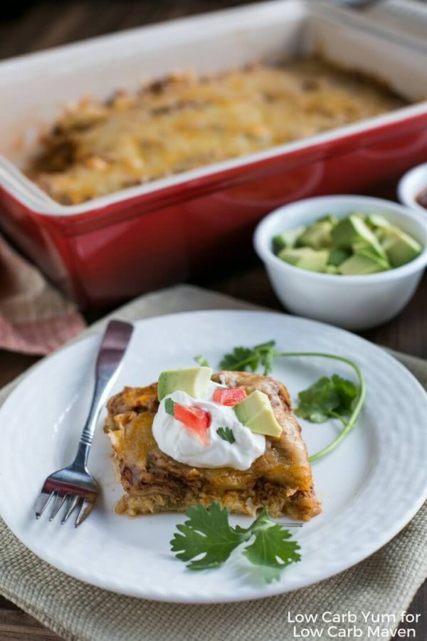 Low Carb Mexican Chicken Casserole is made with shredded chicken, cheese, enchilada sauce and cauliflower rice! #lowcarb #keto #enchilada #casserole #shreddedchickenrecipe