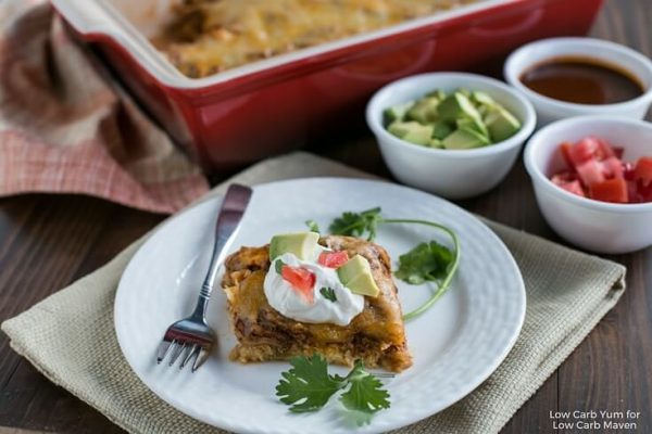  A serving of Mexican chicken casserole on a plate with a fork.