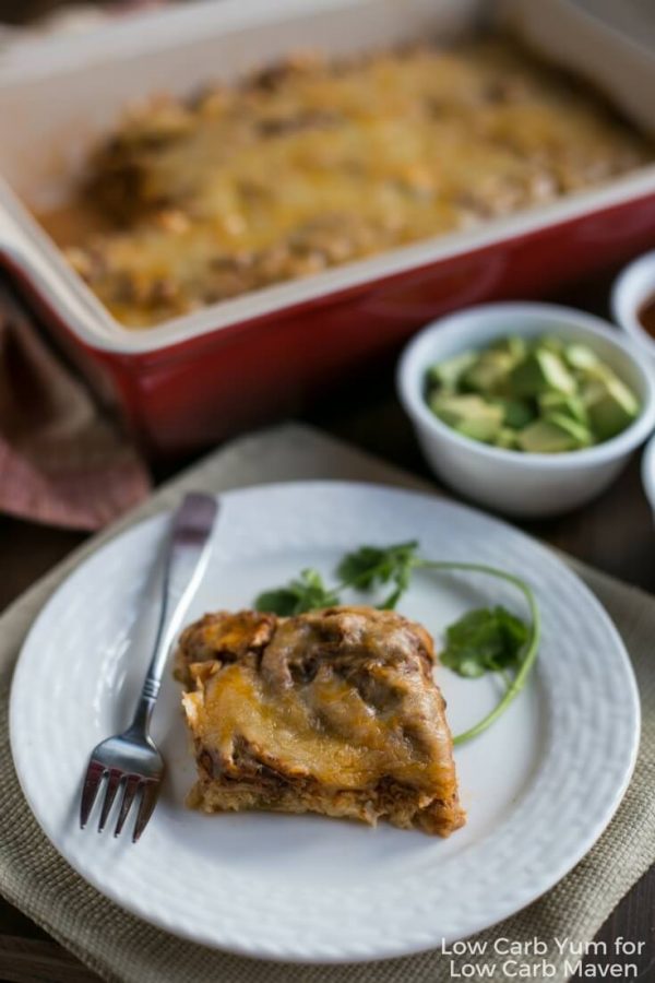  A serving of Mexican chicken casserole on a plate with a fork.