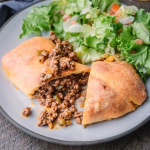 Homemade Sloppy Joe Hot Pockets! for keto diets on a plate served with salad.