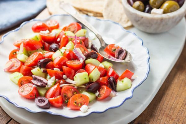 Mediterranean Cucumber Salad with tomatoes, red onion, kalamata olives, and feta cheese.