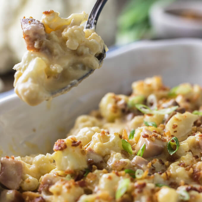 Creamy keto cauliflower mac and cheese casserole with bacon and ham.