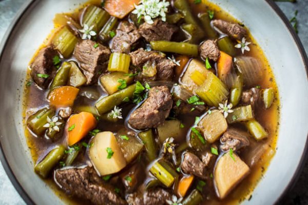 Pressure cooker (Instant Pot) vegetable beef soup in a bowl. 