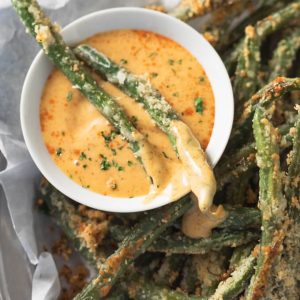 Oven fried Parmesan green beans with sweet mustard dipping sauce.