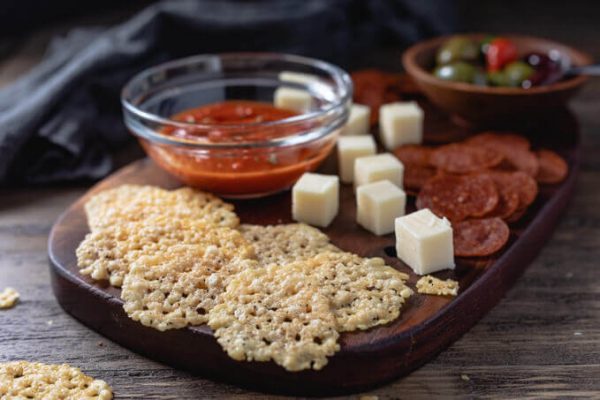 Parmesan crisps with marinara sauce, pepperoni chips and cubed cheese. 