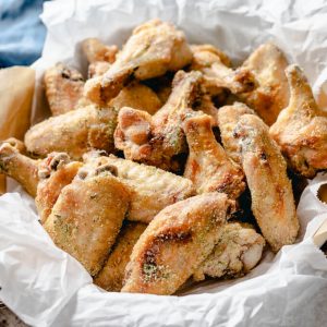 Tangy ranch chicken wings pieces in a basket.