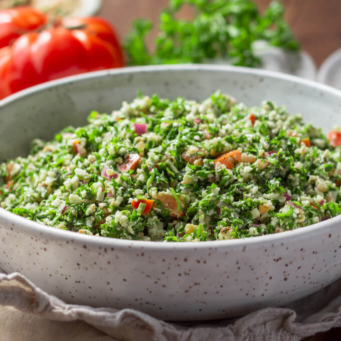 Cauliflower tabbouleh with tomatoes and parsley in a bowl