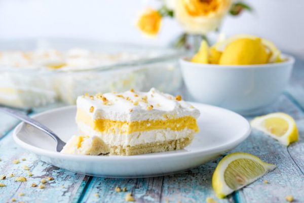 Low carb lemon lush layered dessert with pecans and lemons.