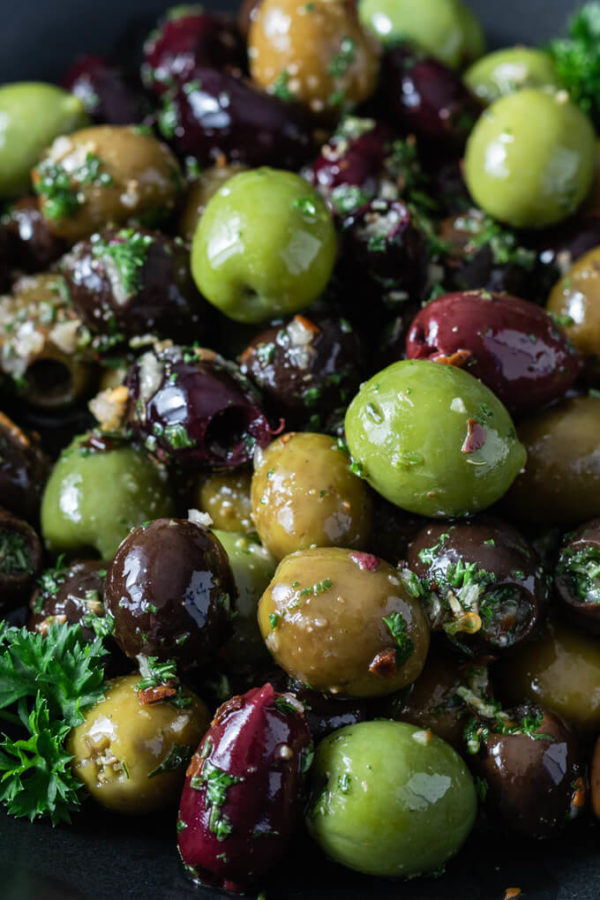 Green, black and Kalamata marinated olives with garlic and fresh herbs